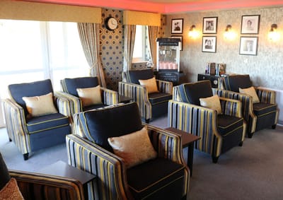 Cozy lounge area with armchairs and decorative curtains