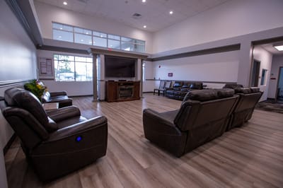 Common area seating in a bright facility lobby