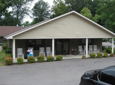 Front entrance of Maple Ridge Manor with rocking chairs