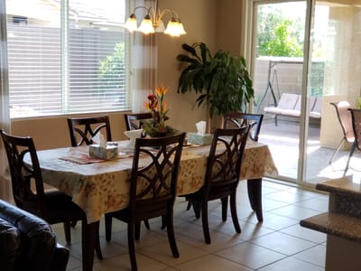 Dining area with table and chairs in a bright space