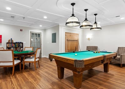 Bright common area with pool table and seating