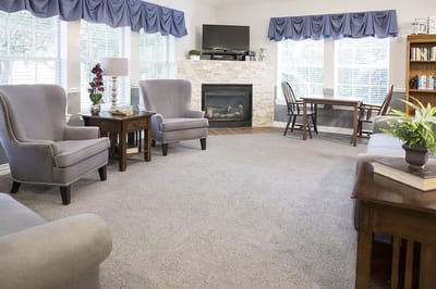Bright common area with seating and natural light