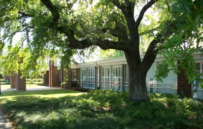 Exterior view of the nursing and rehabilitation center with trees