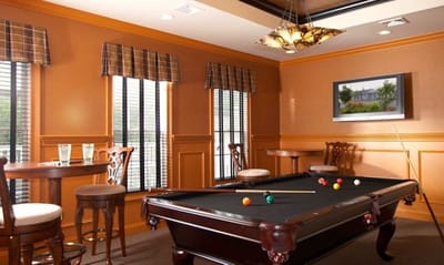 Common area with a pool table and seating