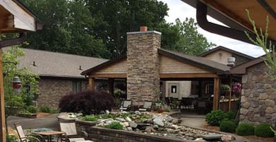 Outdoor seating area with stone facade building