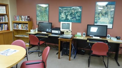 Interior view of a common area with computers and bookshelves