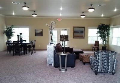 Bright common area with seating and dining space