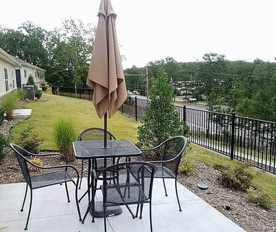 Outdoor seating area with tables and umbrellas