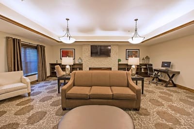 Cozy lounge area with comfortable seating and a television