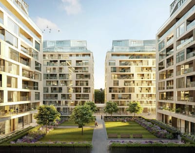 A modern residential complex with landscaped gardens