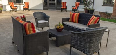 Outdoor sitting area with comfortable chairs and cushions