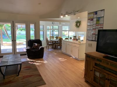 Bright common area with dining table and outdoor view