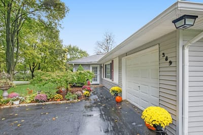 Exterior view of a home surrounded by flowers