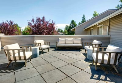 Outdoor seating area with comfortable chairs and tables