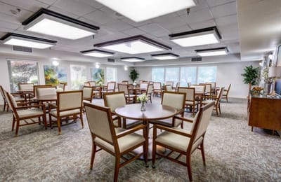 Bright, modern dining area with tables and chairs