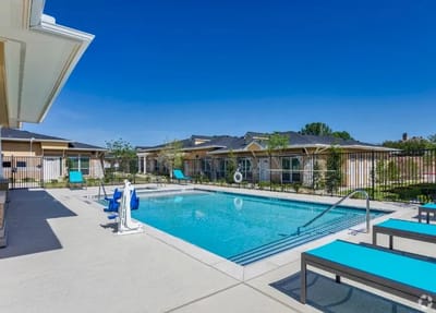 Outdoor pool area with lounge chairs