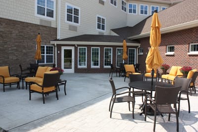 Outdoor patio area with seating and umbrellas