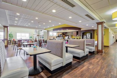 Bright dining area with seating and decor