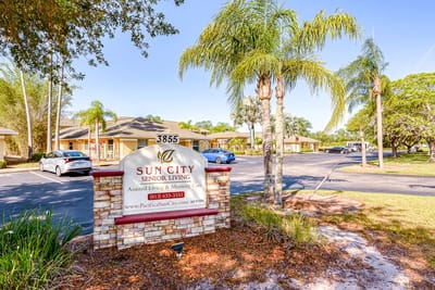 Entrance sign for Sun City Senior Living facility