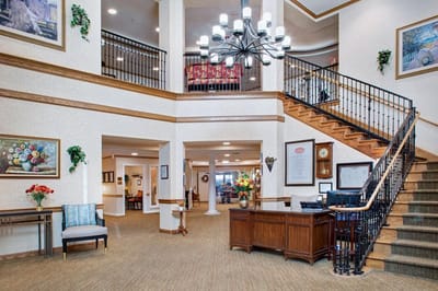 Interior view of a welcoming lobby with staircase and decor
