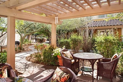 Outdoor space with seating and garden pathways