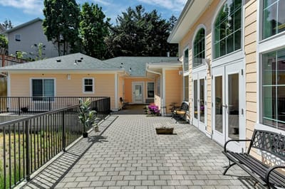 Outdoor patio area with seating and landscaping