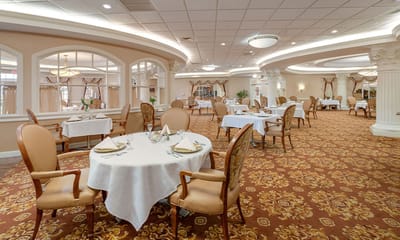 Elegant dining room setup in a senior living facility