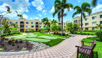 Beautiful landscaped garden area with pathways and seating