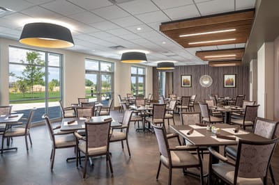 Bright dining room with modern decor and tables.