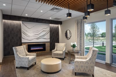 Comfortable lounge area with modern decor and large windows