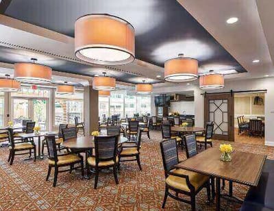 Bright dining room with large windows and tables