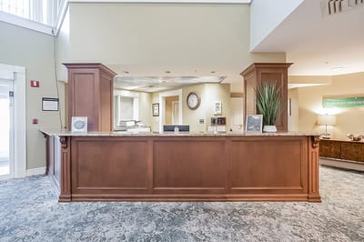Reception area with a wooden front desk