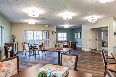 View of a common area with tables and chairs