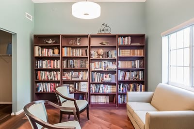 Cozy common area with bookshelves and seating