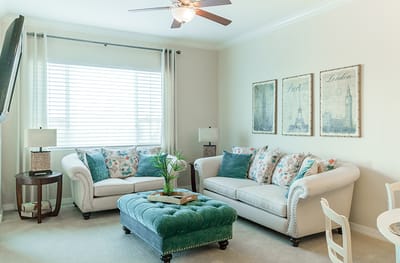 Cozy common area with sofas and wall decor