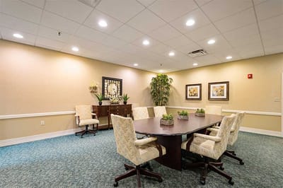 Bright meeting room with large table and chairs