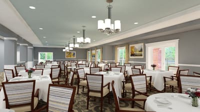 Bright dining room set with tables and flowers