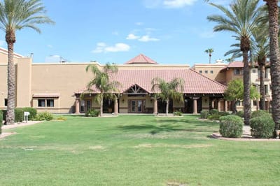 Exterior view of a senior living facility with landscaping