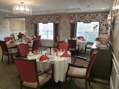 Bright dining room with elegantly set tables