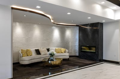 Modern lobby area with a couch and decorative elements