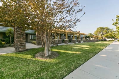Outdoor view of the facility with landscaped gardens