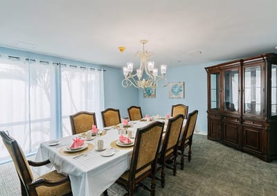 Elegant dining room set for a meal with flowers