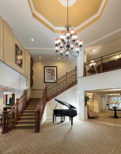 Interior view of a grand lobby with a piano