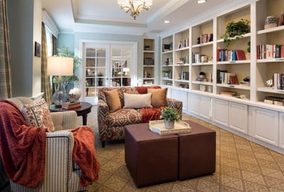 Cozy common area with bookshelves and comfortable seating