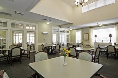 Dining area with tables and chairs, bright and welcoming