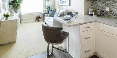 Bright interior of a senior living room with kitchen