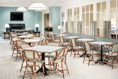 Bright dining area with tables and chairs