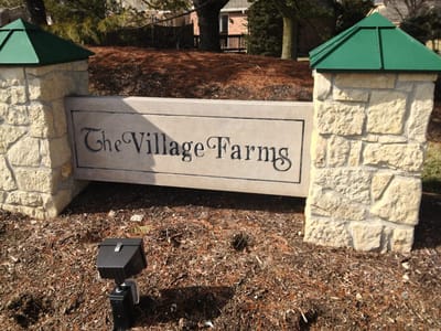 Entrance sign for The Village at the Farms