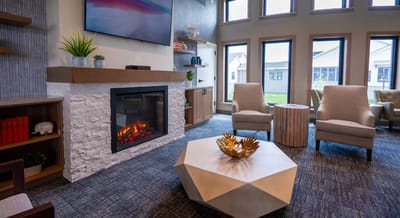 Cozy common area with a fireplace and seating