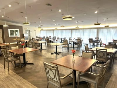 Dining area with tables and chairs, no occupants
